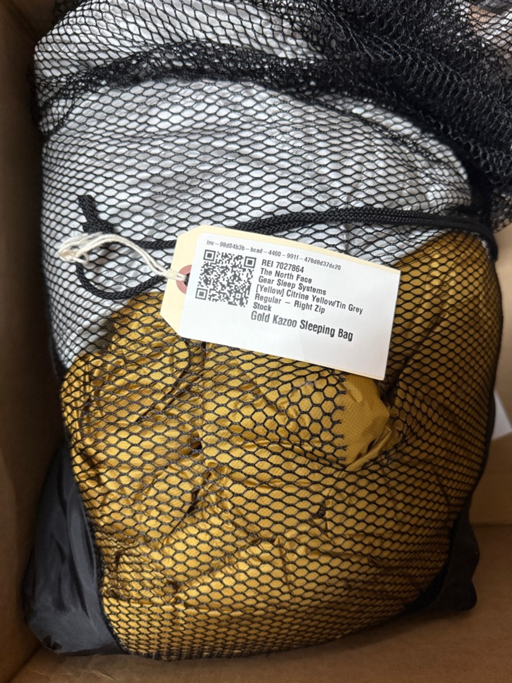 The North Face Gold Sleeping Bag in Black Mesh Stuff Sack